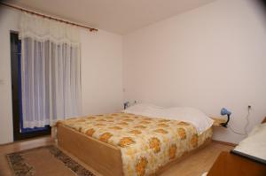 a bedroom with a bed and a window at Apartments with parking space Jelsa, Hvar - 4040 in Jelsa