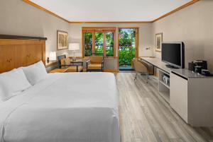 a hotel room with a large bed and a television at Semiahmoo Resort and Spa in Blaine