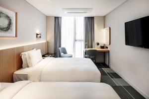 G3 Hotel Chungmuro房間的床