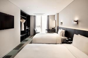 G3 Hotel Chungmuro房間的床