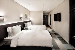G3 Hotel Chungmuro房間的床