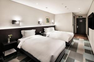 G3 Hotel Chungmuro房間的床
