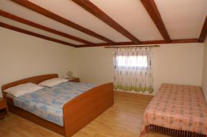 Posteľ alebo postele v izbe v ubytovaní Apartments and rooms by the sea Zubovici, Pag - 4065