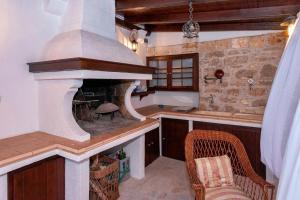 a kitchen with a stone oven in a room at Seaside apartments with a swimming pool Jelsa, Hvar - 2067 in Jelsa