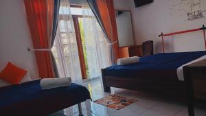 Ένα ή περισσότερα κρεβάτια σε δωμάτιο στο Andorra Tourist Resort Anuradhapura