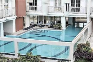 a swimming pool in the middle of a building at Ohana at Tagaytay Prime in Tagaytay