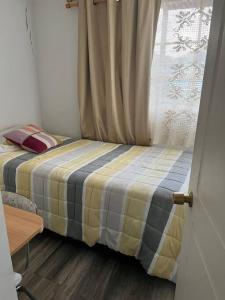Una cama o camas en una habitación de Cómoda Casa en mejor sector de la ciudad