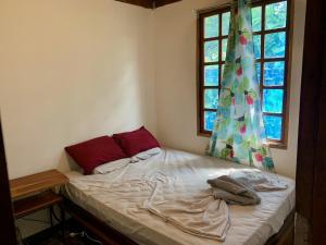 Postel nebo postele na pokoji v ubytování Woodstock Hostel