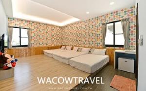 Postel nebo postele na pokoji v ubytování Mann Liuqiu Homestay