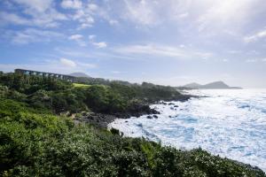 a house on a hill next to the ocean at GOTO RETREAT by Onko Chishin in Goto