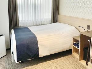 Postel nebo postele na pokoji v ubytování Hotel Abest Grande Takatsuki