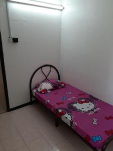Postel nebo postele na pokoji v ubytování Homestay Idaman Penang