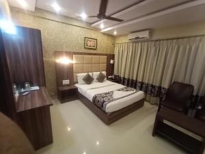Voodi või voodid majutusasutuse Hotel Aditya toas