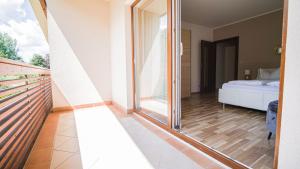 A bed or beds in a room at Alpe Adria Apartments - Top 11 by S4Y