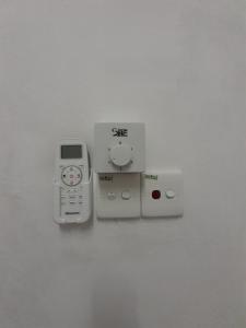 a nintendo wii game system next to at Homestay Idaman B B with 2 room aircond 2 Quen Bed and Not Sharing Room -Privacy in Kuala Terengganu