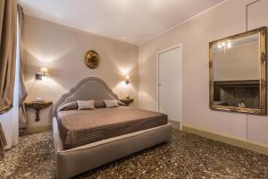 Posteľ alebo postele v izbe v ubytovaní Palazzina Canal