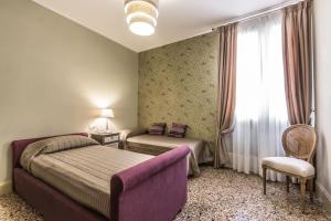 Posteľ alebo postele v izbe v ubytovaní Palazzina Canal