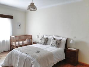 Postel nebo postele na pokoji v ubytování Casinha da Colina