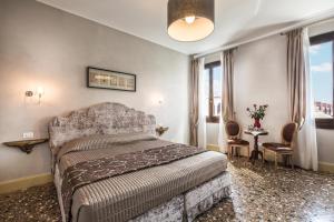 Posteľ alebo postele v izbe v ubytovaní Palazzina Canal
