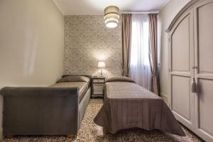 Posteľ alebo postele v izbe v ubytovaní Palazzina Canal