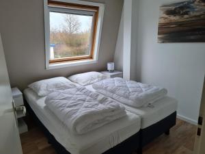 Postel nebo postele na pokoji v ubytování Kustverhuur, Park Schoneveld, Zeester 64