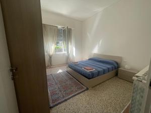 A bed or beds in a room at Nuova Casa vacanze nonna Prassede con giardino e posto auto