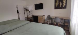 Postel nebo postele na pokoji v ubytování loft industriel L'Idaho