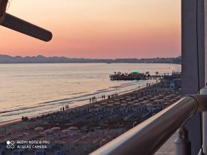 a view of a beach with umbrellas and the ocean at Isabel in Durrës +1 photo
