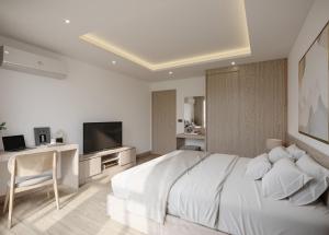 a white bedroom with a large bed and a television at Leon Lasalle Hotel and Residences in Bangkok