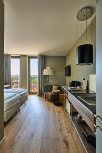 Postel nebo postele na pokoji v ubytování FREIgeist Homes - Serviced Apartments + 37 fotografií