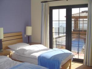Krevet ili kreveti u jedinici u okviru objekta Pier Head Hotel Spa & Leisure