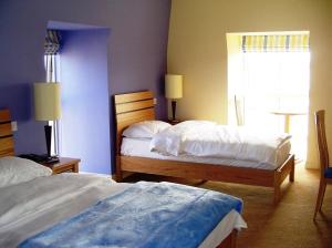 Krevet ili kreveti u jedinici u okviru objekta Pier Head Hotel Spa & Leisure