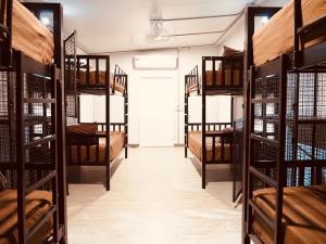 a room filled with lots of bunk beds at Wild Ones Hostel in Bangkok