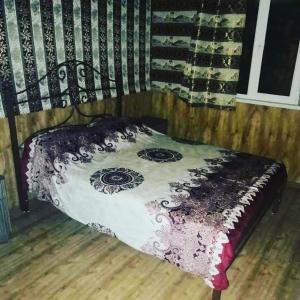 מיטה או מיטות בחדר ב-Golden Beach Sevan