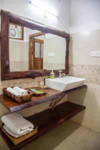 a bathroom with a sink and a mirror at ili-ah ki in Dimāpur