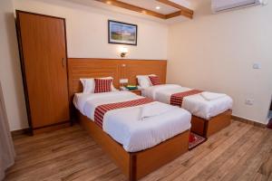 Voodi või voodid majutusasutuse Madhuban Hotel toas