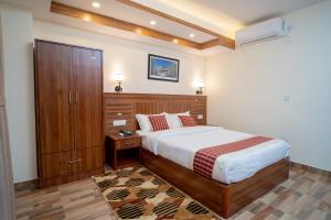 Voodi või voodid majutusasutuse Madhuban Hotel toas
