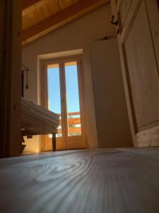 A bed or beds in a room at Chalet Baita delle Favole di RosaRita