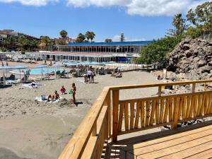 a view of a beach with people on the sand at Balcon del Mar A&V Ocen View Costa del Silencio in Costa Del Silencio