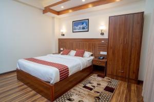 Voodi või voodid majutusasutuse Madhuban Hotel toas