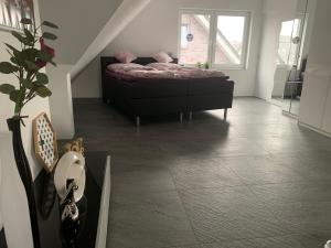 a bedroom with a bed in the middle of a room at Apartment in ruhiger Lage am Rande des Ruhrgebietes in Bottrop