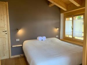 A bed or beds in a room at Chalet Baita delle Favole di RosaRita