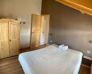 A bed or beds in a room at Chalet Baita delle Favole di RosaRita