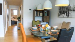 a dining room with a table with food on it at Apartment Seven in Shrewsbury