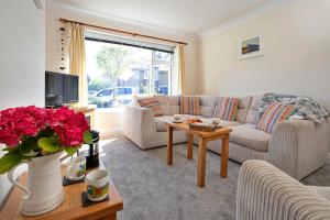 a living room with a couch and a table at Finest Retreats - Helm View in Kendal