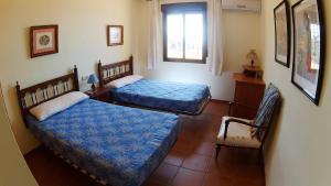 Postel nebo postele na pokoji v ubytování Villa 'El Cortijo' con piscina privada