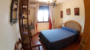 Postel nebo postele na pokoji v ubytování Villa 'El Cortijo' con piscina privada