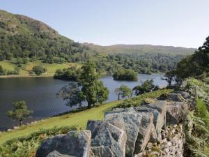 a view of a lake from a rock wall at Turn Cottage in Ulverston