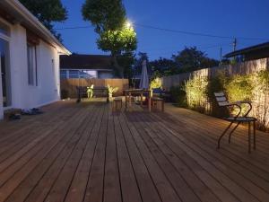 a deck with benches and tables on a house at La Casita in Arès