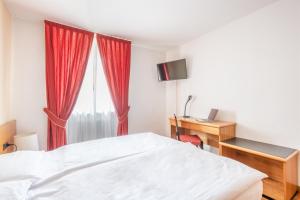 Voodi või voodid majutusasutuse Hotel Alpina toas